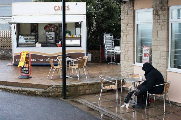 Fig. 3 Man In Cafe on Rainy Day Clevedon - Typical English seaside resort on a wet cold day, there will alawys be someone having a cup of tea in the rain. 1/125 at f/8, ISO 400. 50mm prime lens