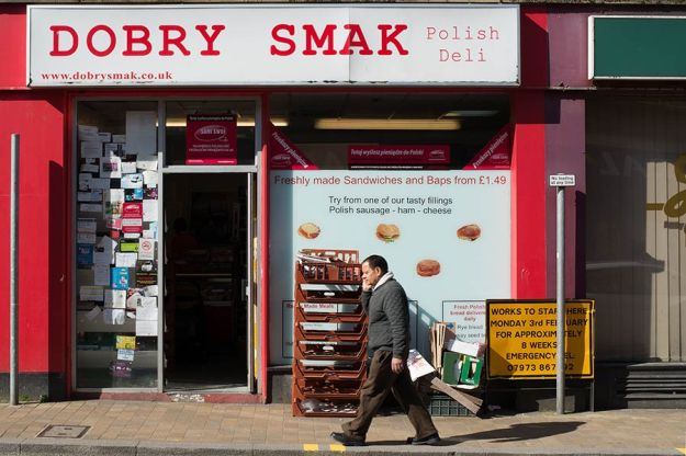 Fig. 2 Polish Deli in Aldershot - Similar to fig. 1 with the shop providing a colourful backdrop to a lone Nepalese passerby. In 1975 Ray-Jones could view the English as a, generally, single race, in 2014 we are a much more exciting cultural mix so we have a Polish Deli in a Hampshire town with a Nepalese resident. - 1/125 at f/16, ISO 200. 50mm prime lens